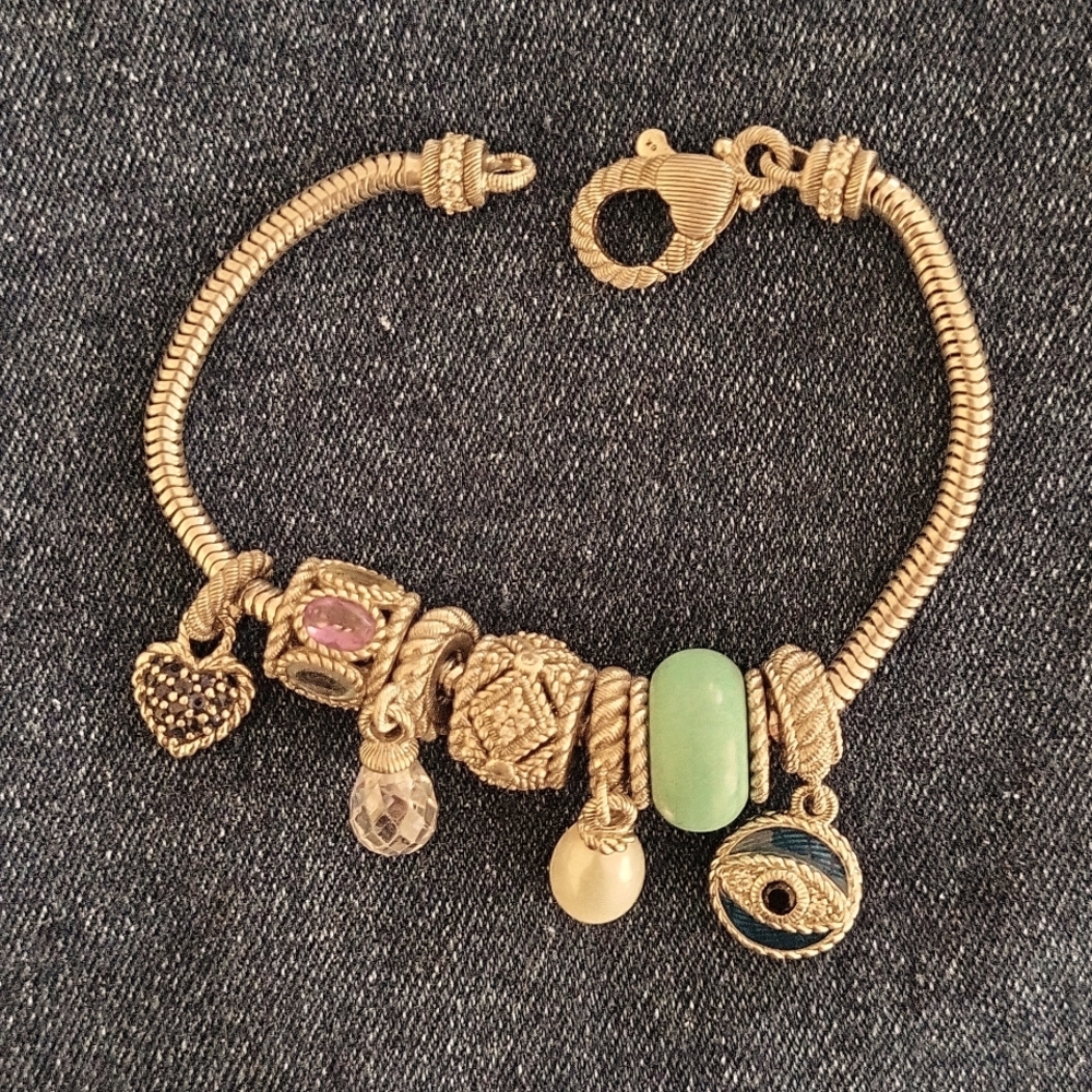 Judith Ripka sterling silver charm bracelet with 7 charms.